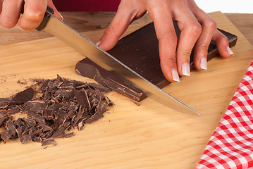 Image showing Chopping dark chocolate