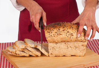 Image showing Cutting bread