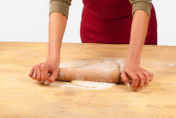 Image showing Flattening dough