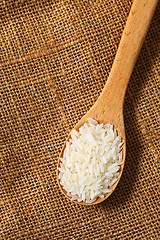 Image showing Rice with wooden spoon 