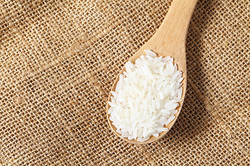 Image showing Rice with wooden spoon