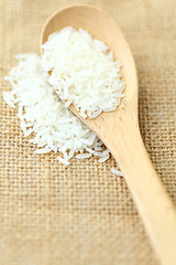 Image showing Rice with wooden spoon
