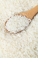 Image showing Rice with wooden spoon