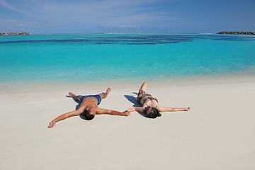 Image showing happy young  couple enjoying summer on beach