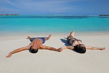 Image showing happy young  couple enjoying summer on beach