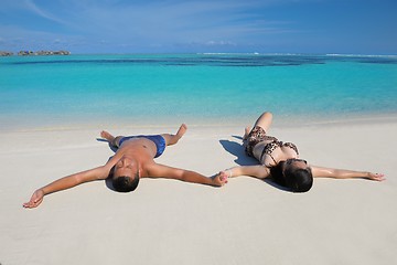 Image showing happy young  couple enjoying summer on beach