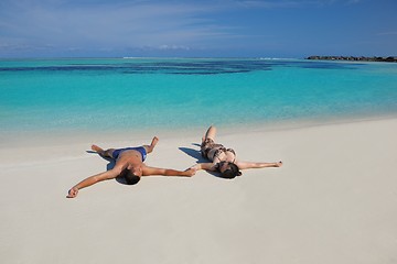 Image showing happy young  couple enjoying summer on beach