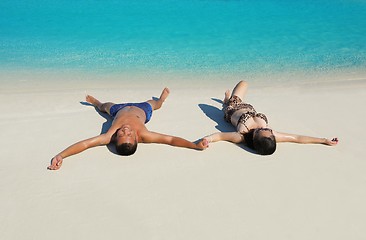 Image showing happy young  couple enjoying summer on beach