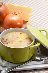 Image showing onion soup with melted cheese and bread on top