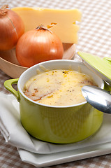 Image showing onion soup with melted cheese and bread on top