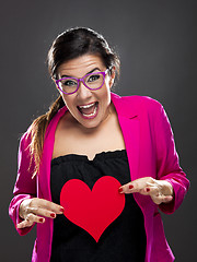 Image showing Funny woman holding a heart