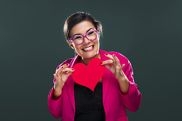 Image showing Funny woman holding a heart