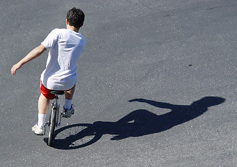 Image showing Boy on a unicycle