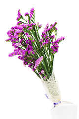 Image showing Bouquet from purple statice flowers arrangement centerpiece in v
