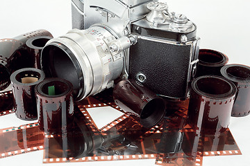 Image showing analog vintage SLR camera and color negative films