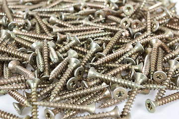 Image showing Closeup pile of screw on white