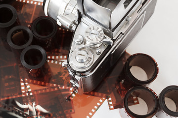 Image showing analog vintage SLR camera and color negative films