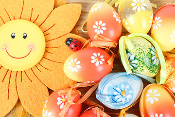 Image showing Bright color easter eggs with bows