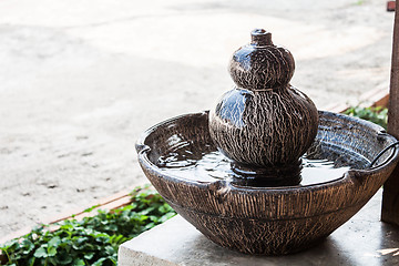 Image showing Jar fountain decorated home  garden