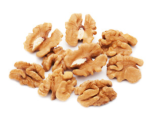 Image showing Heap of fresh shelled walnuts on white background. Close-up.