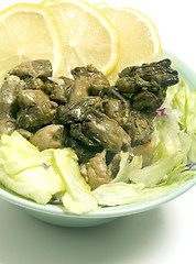 Image showing smoked oyster salad  lemon slices lettuce