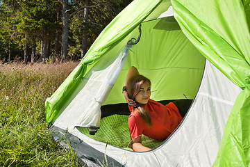 Image showing girl resting in a canvas tent