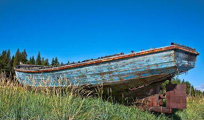 Image showing beached fishing trawler to give a well worn vintage look