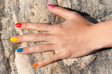 Image showing Female hand with colorful trendy manicure
