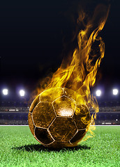 Image showing fiery soccer ball on field