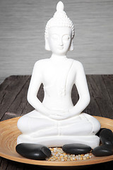 Image showing White statue of a meditating buddha