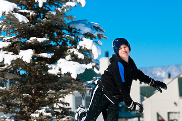 Image showing Child throwing snowball