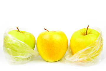 Image showing Group of three unpeeled apples on a white background