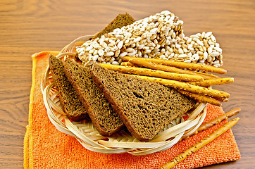 Image showing Rye bread and crispbreads in a wicker plate on napkin