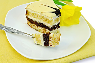 Image showing Cake with yellow tulip on a napkin