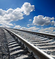 Image showing low view to railroad under deep blue cloudy sky