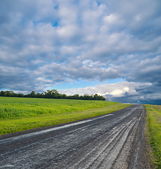 Image showing rural road and stormy clouds