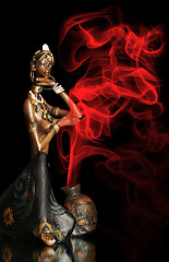 Image showing  Figurine of the African girl on a black background