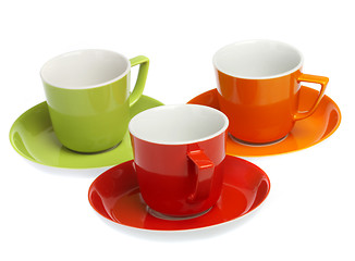 Image showing Three multi-coloured cups on a white background