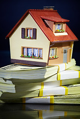 Image showing house on packs of banknotes