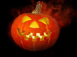 Image showing A scary old jack-o-lantern on black.