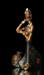 Image showing  Figurine of the African girl on a black background