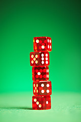 Image showing red dices on green cloth