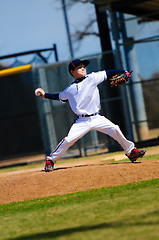 Image showing Little league pitcher in white jersey