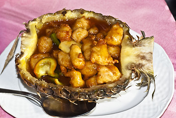 Image showing Chinese chicken sweet and sour sauce inside pineapple