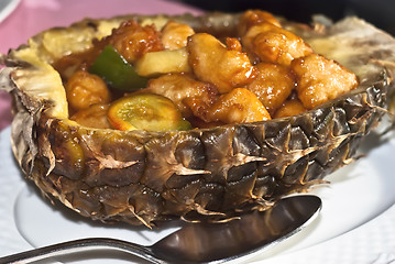 Image showing Chinese chicken sweet and sour sauce inside pineapple