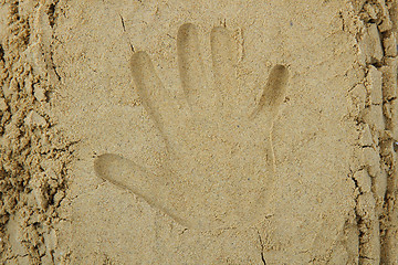 Image showing hand print in the sand