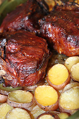 Image showing roasted pork knuckle with potatoes