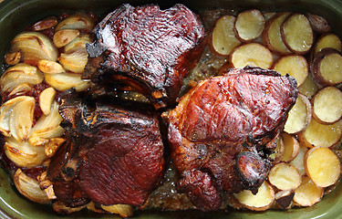 Image showing roasted pork knuckle with potatoes