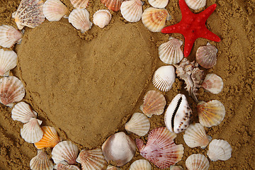 Image showing heart from the sea shells and sand