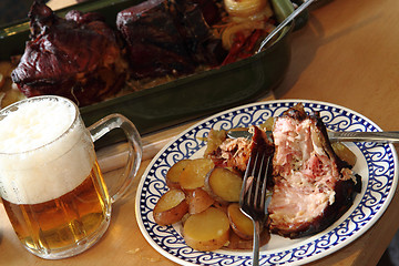 Image showing roasted pork knuckle with potatoes and beer